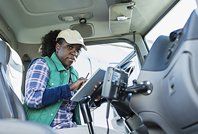 Female trucker using telematics